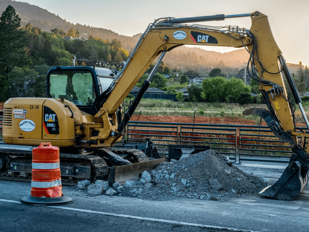 Excavator digging road