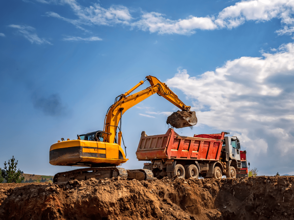 Excavator And Truck at construction site